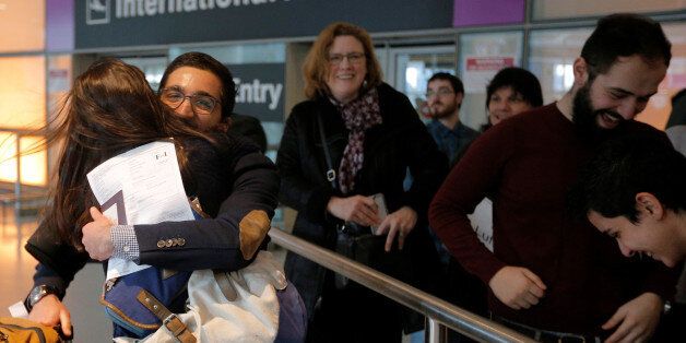 Behnam Partopour, a Worcester Polytechnic Institute (WPI) student from Iran, is greeted by his sister Bahar (L) at Logan Airport after he cleared U.S. customs and immigration on an F1 student visa in Boston, Massachusetts, U.S. February 3, 2017. Partopour was originally turned away from a flight to the U.S. following U.S. President Donald Trump's executive order travel ban. REUTERS/Brian Snyder
