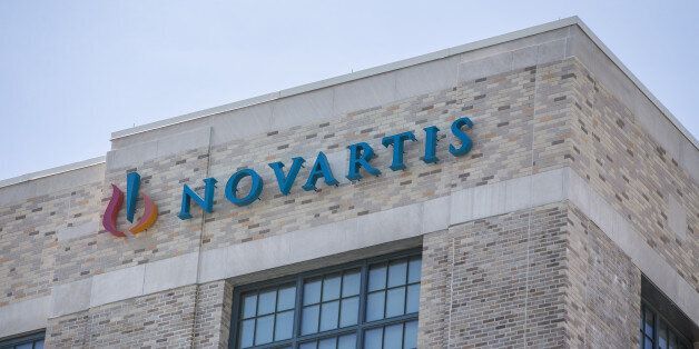 Signage is displayed on the exterior of the Novartis AG Institutes for BioMedical Research building in Cambridge, Massachusetts, U.S., on Friday, Aug. 5, 2016. Navartis AG issued a statement on Aug. 9 stating that they acknowledge that certain associates in Korea conducted small medical meetings and other scientific related activities through trade journals, in violation of their policies and expect to enter court proceedings. Photographer: Scott Eisen/Bloomberg via Getty Images