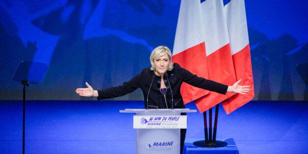 LYON, FRANCE - FEBRUARY 05: French far right National Front (FN) political party's leader, Member of the European Parliament, and candidate for the 2017 French Presidential Election Marine Le Pen delivers a speech during her meeting at the occasion of her 'Assises de la prÃ©sidentielle' at the Cite internationale on February 5, 2017 in Lyon, France. Nearly 3000 supporters came to listen the political program of Marine Le Pen titled '144 Presidential Commitments'. (Photo by Aurelien Morissard/IP3/Getty Images)