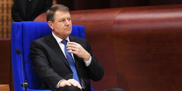 Romanian President Klaus Werner Iohannis looks on before delivering a speech to the Parliamentary Assembly of the Council of Europe, in Strasbourg, eastern France, on January 25, 2017. / AFP / FREDERICK FLORIN (Photo credit should read FREDERICK FLORIN/AFP/Getty Images)