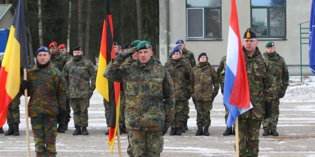 Commander of the NATO battalion battlegroup and the German contingent in Lithuania Lieutenant Colonel Christoph Huber salutes during a welcoming ceremony in Rukla, Lithuania, on February 7 , 2017.Lithuania welcomed several hundred German troops who will lead a multinational NATO battalion, one of four the alliance is deploying on a rotational basis this year to deter Russia by beefing up its eastern flank. / AFP / Petras Malukas (Photo credit should read PETRAS MALUKAS/AFP/Getty Images)