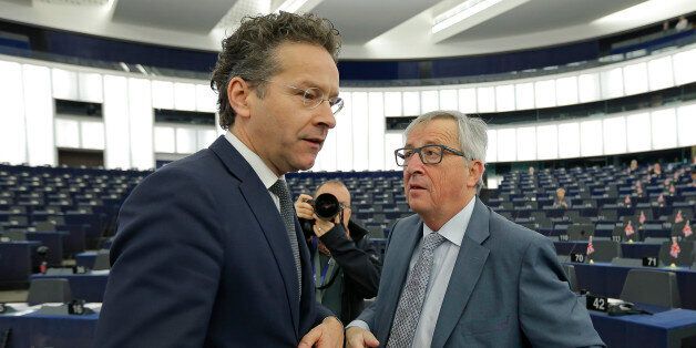 Commission President Jean-Claude Juncker (R) talks with Dutch Finance Minister and Eurogroup President Jeroen Dijsselbloem at the European Parliament in Strasbourg, France, ahead of a debate on the future of the Economic and Monetary Union, December 15, 2015. REUTERS/Vincent Kessler