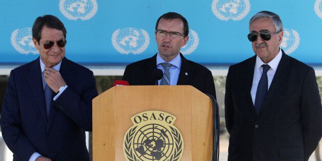 U.N. envoy Espen Barth Eide (C) speaks to the media next to Greek Cypriot leader and Cyprus President Nicos Anastasiades (L) and Turkish Cypriot leader Mustafa Akinci at the United Nations offices in the buffer zone of Nicosia airport, Cyprus September 14, 2016. REUTERS/Yiannis Kourtoglou