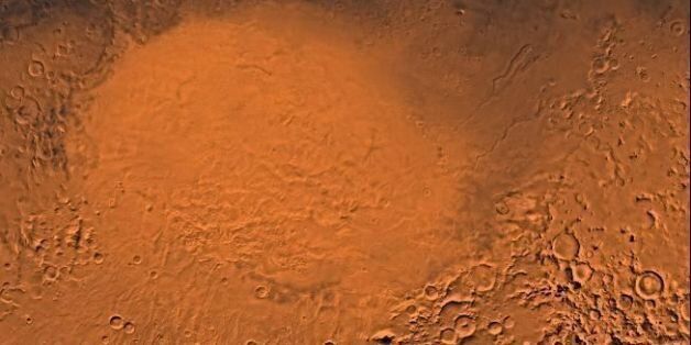WASHINGTON, DC - DECEMBER 12: This photo released 09 December by Jet Propulsion Lab in Pasadena, CA, and produced by the US Geological Survey, shows a color image of the Hellas Planitia region of Mars taken by the Viking Orbiter. The scene shows the Hellas Plain within the 1,800 kilometer (1,117 mile) diameter Hellas Basin, an ancient impact basin, and the largest basin on Mars, formed when a large projectile, like an asteroid, comet or meteor, hit the surface. (Photo credit should read JPL/AFP/Getty Images)