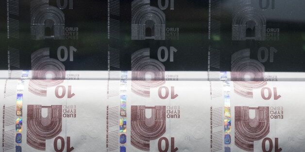 An intaglio printing plate, used for the printing of ten euro currency banknotes, and a sheet of printing paper sits on display inside the Deutsche Bundesbank's money museum in Frankfurt, Germany, on Thursday, Dec. 29, 2016. German business sentiment rose to the highest level in almost three years in December, signaling growth in Europe's largest economy picked up speed toward the end of the year. Photographer: Alex Kraus/Bloomberg via Getty Images