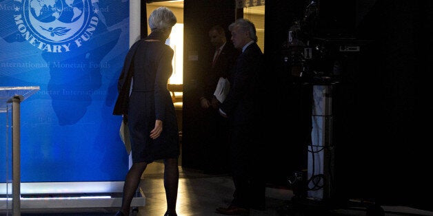 Christine Lagarde, managing director of the International Monetary Fund (IMF), exits after delivering a statement at the IMF headquarters in Washington, D.C., U.S., on Monday, Dec. 19, 2016. The IMF's executive board reiterated its backing for Lagarde, indicating support for her to remain managing director of the lender despite being convicted of negligence by a French court. Photographer: Andrew Harrer/Bloomberg via Getty Images