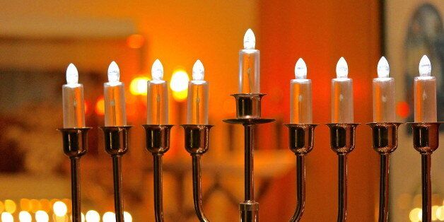 Electric Hanukkah - Festival of Lights menorah lights at night indoors.