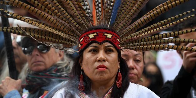 Native Americans lead demonstrators as they march to the Federal Building in protest against President Donald Trump's executive order fast-tracking the Keystone XL and Dakota Access oil pipelines, in Los Angeles, California on February 5, 2017.US President Donald Trump has revived two pipeline projects blocked by his predecessor on environmental grounds. / AFP / Mark RALSTON (Photo credit should read MARK RALSTON/AFP/Getty Images)