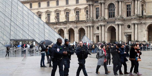 Police officers patrol in front of the Louvre Pyramid in Paris on February 4, 2017 a day after a machete-wielding attacker lunged at four French soldiers while shouting 'Allahu Akbar' ('God is greatest') in a public area that leads to one of the Louvre Museum's entrances.The condition of a man who was shot after attacking troops at the Louvre in Paris has improved and is 'no longer life-threatening', a source close to the case said on February 4, 2017. But the man has not recovered sufficiently to be able to communicate with investigators, the source said. / AFP / JACQUES DEMARTHON (Photo credit should read JACQUES DEMARTHON/AFP/Getty Images)