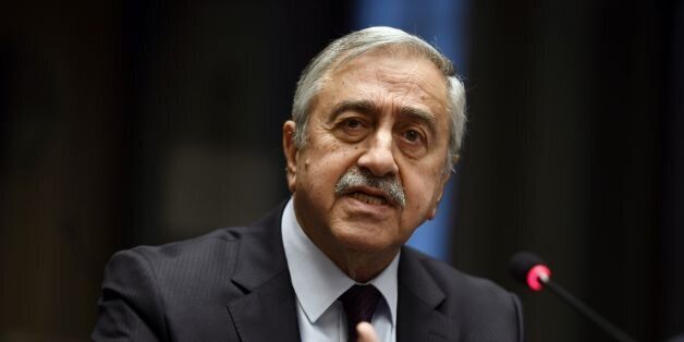 Turkish Cypriot leader Mustafa Akinci gestures as he speaks during a press conference on UN-sponsored Cyprus peace talks on January 13, 2017 at the Unites Nations headquarters in Geneva.Hopes for a peace deal in Cyprus stalled on January 13, 2017 over a decades-old dispute, with the rival sides at loggerheads over the future of Turkish troops on the divided island. A week of UN-brokered talks in Geneva between Greek Cypriot President and Turkish Cypriot leader sparked optimism that an agreement to reunify the island could be at hand. But any settlement will require an agreement on Cyprus's future security, with key players Greece, Turkey and former colonial power Britain needing to sign on. / AFP / PHILIPPE DESMAZES (Photo credit should read PHILIPPE DESMAZES/AFP/Getty Images)