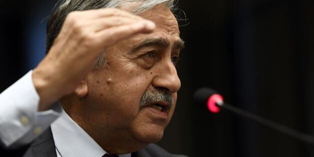 Turkish Cypriot leader Mustafa Akinci gestures as he speaks during a press conference on UN-sponsored Cyprus peace talks on January 13, 2017 at the Unites Nations headquarters in Geneva.Hopes for a peace deal in Cyprus stalled on January 13, 2017 over a decades-old dispute, with the rival sides at loggerheads over the future of Turkish troops on the divided island. A week of UN-brokered talks in Geneva between Greek Cypriot President and Turkish Cypriot leader sparked optimism that an agreement to reunify the island could be at hand. But any settlement will require an agreement on Cyprus's future security, with key players Greece, Turkey and former colonial power Britain needing to sign on. / AFP / PHILIPPE DESMAZES (Photo credit should read PHILIPPE DESMAZES/AFP/Getty Images)