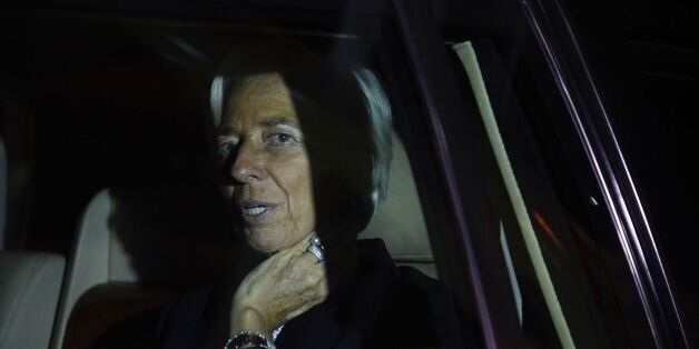 Managing Director of the International Monetary Fund (IMF) Christine Lagarde looks from a car after she arrived at Entebbe Airport on January 25, 2017 for a visit to Uganda. / AFP / Isaac Kasamani (Photo credit should read ISAAC KASAMANI/AFP/Getty Images)