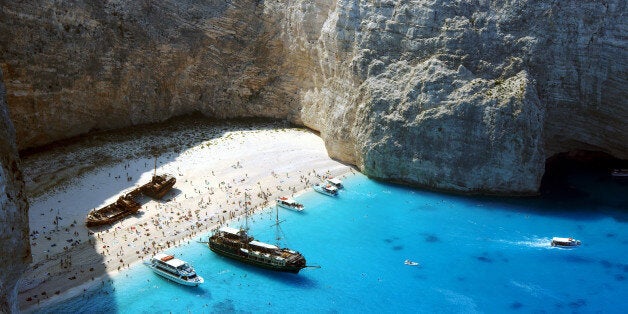 People on shipwreck beach at Zakynthos island, Greece