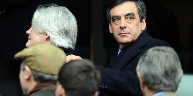 French Prime minister FranÃ§ois Fillon (R) arrives with his wife to attend the rugby union 6 Nations tournament match France versus England, on March 11, 2012 at the Stade de France in Saint-Denis, outside Paris. AFP PHOTO / MARTIN BUREAU (Photo credit should read MARTIN BUREAU/AFP/Getty Images)