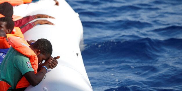 Migrants are seen during rescue operation in the Mediterranea Sea October 20, 2016. Yara Nardi/Italian Red Cross press office/Handout via Reuters ATTENTION EDITORS - THIS IMAGE WAS PROVIDED BY A THIRD PARTY. EDITORIAL USE ONLY.