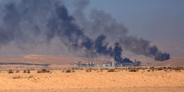 A picture taken on February 7, 2017, shows smoke billowing from Hayyan oil field, east of the central Syrian Homs province, as regime forces advance to capture the field from Islamic State group. / AFP / STRINGER (Photo credit should read STRINGER/AFP/Getty Images)
