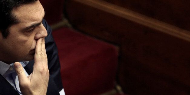 Greek Prime Minister Alexis Tsipras looks on before answering a question on corruption, during the Prime Minister's Question Time at the parliament in Athens, Greece, February 10, 2017. REUTERS/Alkis Konstantinidis