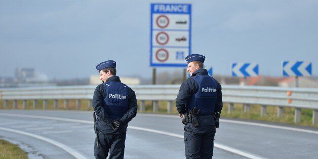 DE PANNE, BELGIUM - FEBRUARY 24: Belgian police check the vehicles to prevent refugee entrance into the country as vehicles cross the border from France into Belgium, in De Panne Belgium on February 24, 2016. Belgian authorities decided to check the entrances into the country after French authorities' decision of evacuation of the refugees at a refugee camp located in French's Belgian border town Calais. (Photo by Dursun Aydemir/Anadolu Agency/Getty Images)