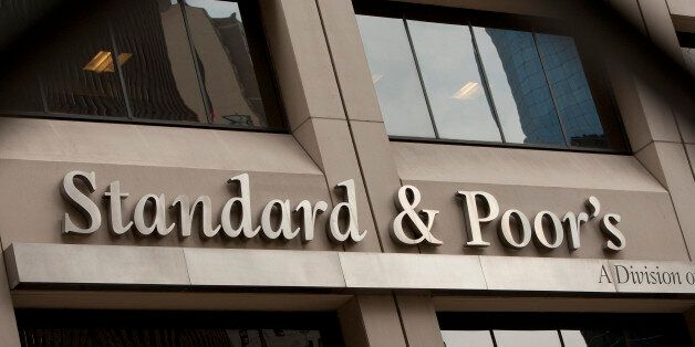 The Standard & Poor's Financial Services LLC logo is displayed in front of the company's headquarters in New York, U.S., on Thursday, July 28, 2011. U.S. stocks slid, dragging the Standard & Poor's 500 Index lower for a fourth day, and six-month Treasury bills sank as lawmakers indicated they were no closer to an agreement to raise the debt ceiling. The dollar gained and commodities retreated. Photographer: Scott Eells/Bloomberg via Getty Images