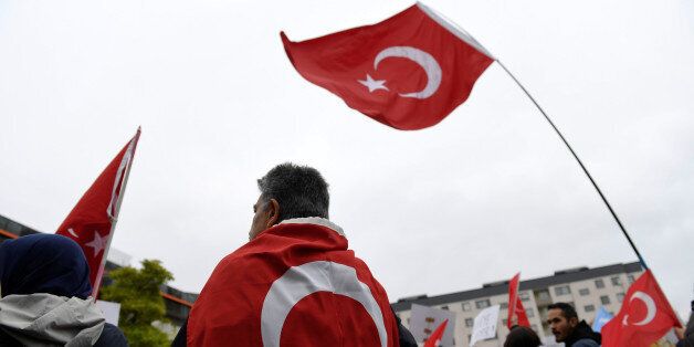 Turkish flags during a protest meeting outside the Bredangsskolan school in southern Stockholm, Sweden, October 15, 2015, following the cancellation of the panel 'July 15th - Behind the Scene of the Bloody Coup' about the July coup attempt in Turkey. Henrik Montgomery/TT News Agency/via Reuters ATTENTION EDITORS - THIS IMAGE WAS PROVIDED BY A THIRD PARTY. FOR EDITORIAL USE ONLY. NOT FOR SALE FOR MARKETING OR ADVERTISING CAMPAIGNS. THIS PICTURE IS DISTRIBUTED EXACTLY AS RECEIVED BY REUTERS, A