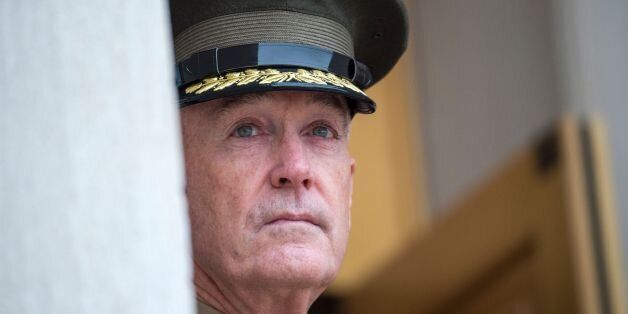 Chairman of the Joint Chiefs of Staff General Joseph Dunford waits for the arrival of US Secretary of Defense James Mattis at the Pentagon on January 21, 2017. / AFP / PAUL J. RICHARDS (Photo credit should read PAUL J. RICHARDS/AFP/Getty Images)