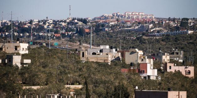 CORRECTION - A general view taken on January 23, 2017 from the Palestinian West Bank village of Hares, south of the city Nablus, shows the Israeli Jewish settlement of Ariel.Israel has approved the construction of 2,500 settler homes in the occupied West Bank, the defence ministry said on January 24, 2017 making good on promises to expand such building following the election of US President Donald Trump, and marking the largest recent announcement of settlement building. / AFP / JAAFAR ASHTIYEH / The erroneous mention appearing in the metadata of this photo by JAAFAR ASHTIYEH has been modified in AFP systems in the following manner: [January 23] instead of [January 24]. Please immediately remove the erroneous mention from all your online services and delete it from your servers. If you have been authorized by AFP to distribute it to third parties, please ensure that the same actions are carried out by them. Failure to promptly comply with these instructions will entail liability on your part for any continued or post notification usage. Therefore we thank you very much for all your attention and prompt action. We are sorry for the inconvenience this notification may cause and remain at your disposal for any further information you may require. (Photo credit should read JAAFAR ASHTIYEH/AFP/Getty Images)