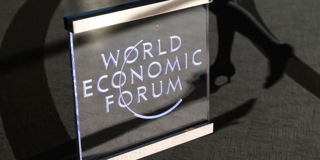 A woman enters the World Economic Forum on the closing day of the forum, on January 20, 2017 in Davos. / AFP / FABRICE COFFRINI (Photo credit should read FABRICE COFFRINI/AFP/Getty Images)