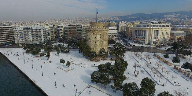 THESSALONIKI, GREECE - JANUARY 12: Aerial view of the snowed White Tower of Thessaloniki on January 12, 2017 in Thessaloniki, Greece. Greece faced a difficult weather which included very low temperatures, heavy frost and snow. The White Tower of Thessaloniki is a monument and museum on the waterfront of the city of Thessaloniki. An old Byzantine fortification which was mentioned around the 12th century and reconstructed by the Ottomans to fortify the city's harbour it became a notorious prison and scene of mass executions during the period of Ottoman rule. It has been adopted as the symbol of the city. (Photo by Athanasios Gioumpasis/Getty Images)