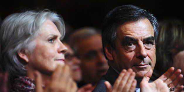 PARIS, FRANCE - NOVEMBER 25: Former French Prime Minister Francois Fillon (R), candidate of the party 'Les Republicains', with his wife Penelope Fillon during his meeting at the Exhibition Park of the Porte de Versailles on November 25, 2016 in Paris, France. Conservative Francois Fillon faces off against opponent Alain Juppe in the second round of primary voting on November 27th, the winner of which will be named as the party's candidate for the French Presidential elections in April 2017. (Photo by Frederic Stevens/Getty Images)