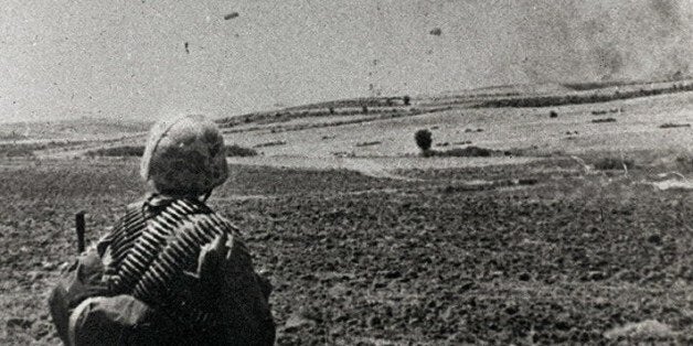 Picture of Turkish paratroopers land in Cyprus, 20 July 1974, during Turkey's invasion of north Cyprus. Twenty-three yeares later, Greek-Cypriots are ceremoniously honouring, 20 July, those who died during the invasion while Turkish-Cypriots on the other side of the Green Line which divides the two communities are celebrating the anniversary of their break-away republic. (Photo credit should read STR/AFP/Getty Images)