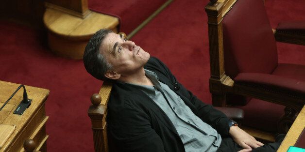 Greek Finance Minister Euclid Tsakalotos during the debate at the Greek Parliament on the Omnibus Bill on privatization and other prior actions, demanded by the countrys lenders to unlock 2.8 billion euros of its loan aid. The bill that puts several state organizations into a privatization fund securing approval for further rescue loans, was approved with 152 votes on Tuesday September 27, 2016 (Photo by Panayiotis Tzamaros/NurPhoto via Getty Images)