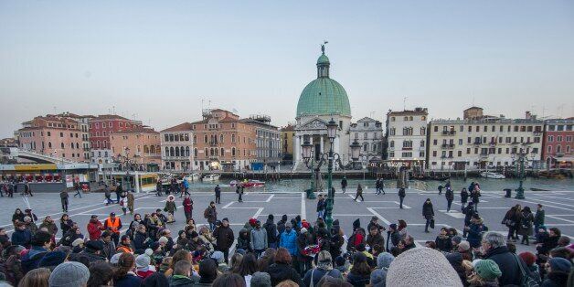 VENICE, ITALY - January 27: Refugees, members of the African community and locals attend a vigil to remember 22 year old, Pateh Sabally, who drowned in the Grand Canal on January 27, 2017 in Venice, Italy.The news of death of the Gambian refugee made the headlines on international media after few videos showing him drowning while some Venetian onlookers watched and shouted racial abuse.PHOTOGRAPH BY Awakening / Barcroft ImagesLondon-T:+44 207 033 1031 E:hello@barcroftmedia.com -New York-T:+1 212 796 2458 E:hello@barcroftusa.com -New Delhi-T:+91 11 4053 2429 E:hello@barcroftindia.com www.barcroftimages.com (Photo credit should read Awakening / Barcroft Images / Barcroft Media via Getty Images)