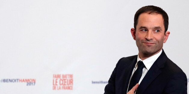 Former French education minister Benoit Hamon reacts after partial results in the second round of the French left's presidential primary election in Paris, France, January 29, 2017. REUTERS/Christian Hartmann