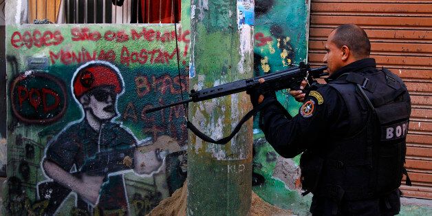 Rio de Janeiro, Brazil - June 28, 2012: The Special Operations Battalion BOPE, police carried out a raidwith the purpose of drug enforcement in the favela of Vila Cruzeiro, in the 'AlemÃ£o' Complex in the early morning. This is one of the biggest shanty town in Rio de Janeiro and used to be the hideout of drug dealers, a big Rio de Janeiro problem.