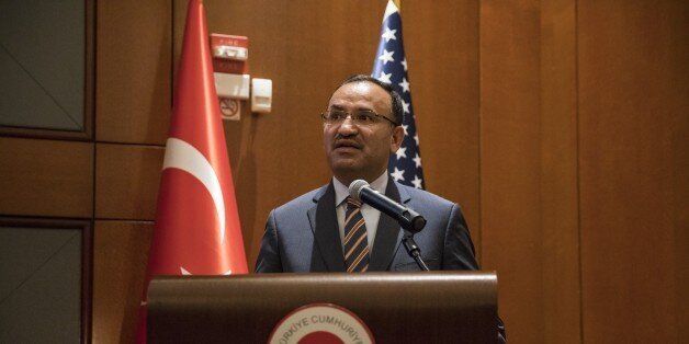 WASHINGTON, USA - OCTOBER 28: Turkish Justice Minister Bekir Bozdag delivers a speech during the opening ceremony of an exhibition of photographs during the July 15th Coup Attempt at the Embassy of Turkey in Washington, USA on October 28, 2016. (Photo by Samuel Corum/Anadolu Agency/Getty Images)