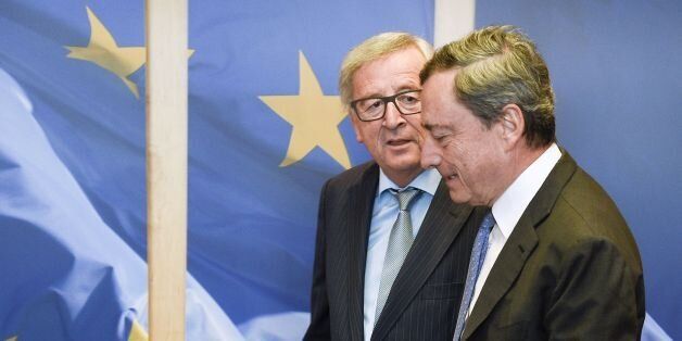 European Commission President Jean-Claude Juncker (L) welcomes President of the European Central Bank Mario Draghi ahead of a bilateral meeting at the EU Headquarters in Brussels on June 13, 2016. / AFP / JOHN THYS (Photo credit should read JOHN THYS/AFP/Getty Images)
