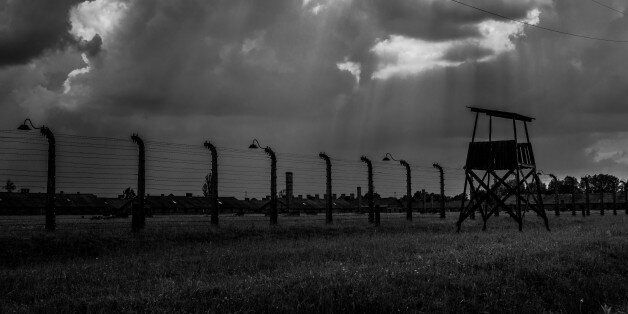 Auschwitz, Poland - May 26, 2014: The Auschwitz concentration camp is located about 50 km from Krakow. The picture shows fiew guard towers in camp.