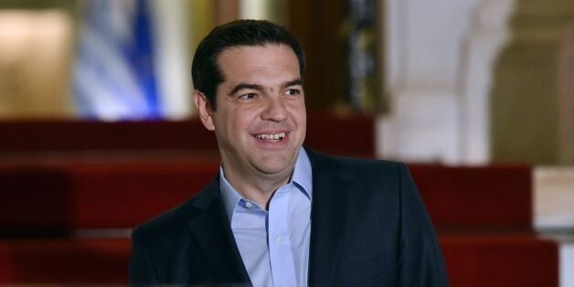 Greek Prime Minister Alexis Tsipras smiles as he waits for the Italian president ahead of a meeting in Athens on January 17, 2017.Italian President Sergio Mattarella is on a two-day official visit to Greece. / AFP / LOUISA GOULIAMAKI (Photo credit should read LOUISA GOULIAMAKI/AFP/Getty Images)