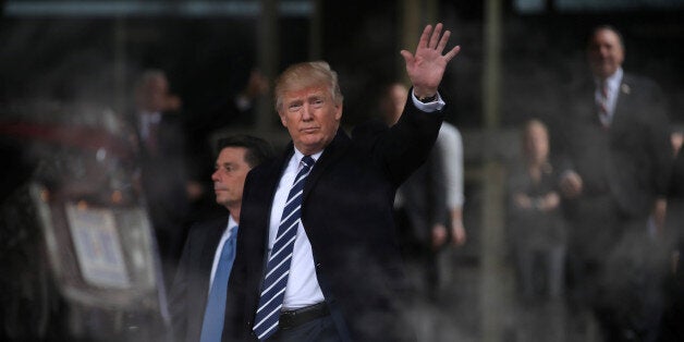 U.S. President Donald Trump waves as he leaves the Central Intelligence Agency (CIA) headquarters after delivering remarks during a visit in Langley, Virginia U.S., January 21, 2017. REUTERS/Carlos Barria