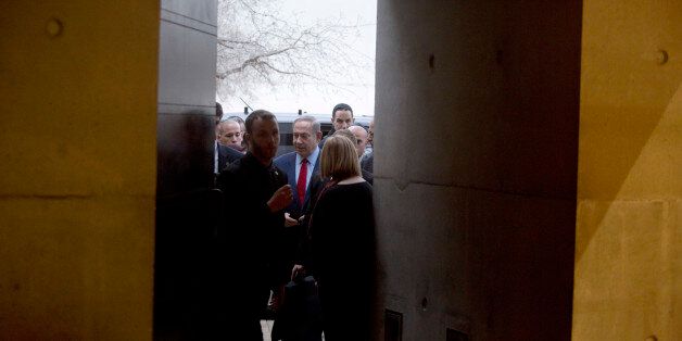 JERUSALEM, ISRAEL - JANUARY 26: (ISRAEL OUT) Israel's Prime Minister Benjamin Netanyahu (C) arrives before a speach to members of the diplomatic corps in Israel in the Yad Vashem Synagogue on January 26, 2017 in Jerusalem, Israel. Thousands of people will come together today to remember and honour the millions killed in the Holocaust and mark the 71th anniversary of the liberation of Auschwitz by Soviet troops on 27th January, 1945. Auschwitz was among the most notorious of the concentration camps run by the Nazis during WWII and whilst it is impossible to put an exact figure on the death toll it is alleged that over a million people lost their lives in the camp, the majority of whom were Jewish. (Photo by Lior Mizrahi/Getty Images)