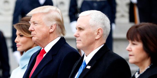 WASHINGTON, DC - JANUARY 20: First Lady Melania Trump, United States President Donald Trump, Vice President Mike Pence and Karen Pence stand on the east front steps of the Capitol Building after Trump is sworn in at the 58th Presidential Inauguration on Capitol Hill in Washington, D.C. on January 20, 2017. (Photo by John Angelillo-Pool/Getty Images)