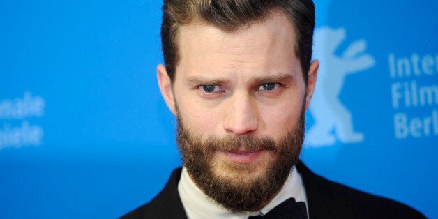 Actor Jamie Dornan arrives for the screening of the movie 'Fifty Shades of Grey' at the 65th Berlinale International Film Festival in Berlin February 11, 2015. REUTERS/Stefanie Loos (GERMANY - Tags: ENTERTAINMENT HEADSHOT)