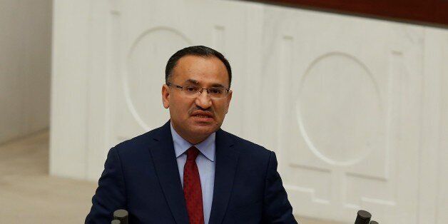 ANKARA, TURKEY - JANUARY 9: Turkey's Minister of Justice Bekir Bozdag makes a speech during the parliamentary session for the debates on a bill to change the Turkish constitution at the Turkish Grand National Assembly (TBMM) in Ankara, Turkey on January 9, 2017. Parliaments general assembly started debate over a landmark bill to change the countrys constitution. (Photo by Murat Kaynak/Anadolu Agency/Getty Images)