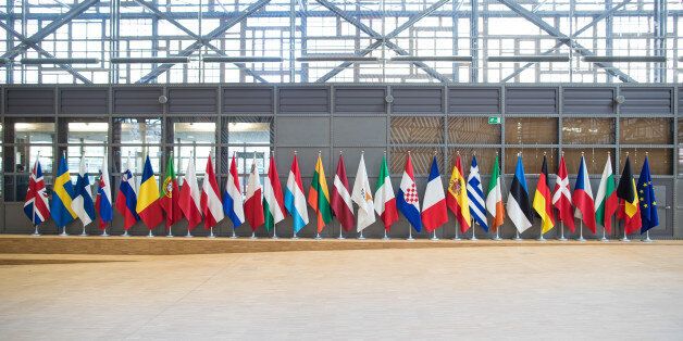 The twenty eight European Union (EU) members' national flags, including the U.K.'s Union Flag, also known as Union Jack, left, hang from poles inside the EU's new Europa building, also known as the Space Egg, ahead of a Eurogroup meeting of euro-area finance ministers in Brussels, Belgium, on Thursday, Jan. 26, 2017. Greece has less than a month to iron out disagreements with its creditors over how to move forward with a rescue package that has been keeping the country afloat since 2010.Photographer: Jasper Juinen/Bloomberg via Getty Images