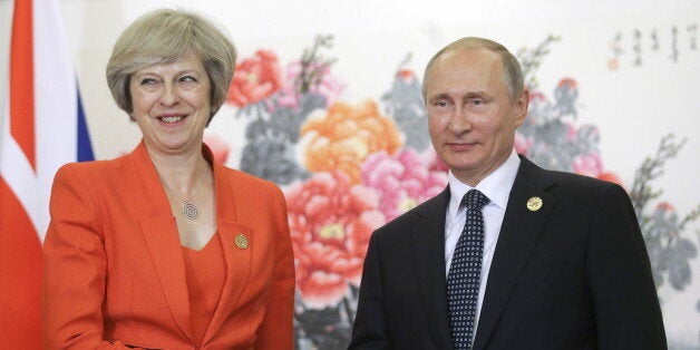 HANGZHOU, CHINA - SEPTEMBER 4, 2016: Russia's President Vladimir Putin (R) shakes hands with British Prime Minister Theresa May during a meeting. Mikhail Metzel/TASS (Photo by Mikhail Metzel\TASS via Getty Images)