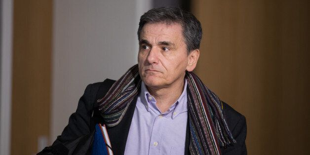 Euclid Tsakalotos, Greece's finance minister, departs from a Eurogroup meeting of euro-area finance ministers at the Europa building in Brussels, Belgium, on Thursday, Jan. 26, 2017. Greece has less than a month to iron out disagreements with its creditors over how to move forward with a rescue package that has been keeping the country afloat since 2010. Photographer: Jasper Juinen/Bloomberg via Getty Images