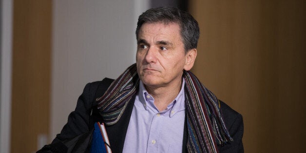 Euclid Tsakalotos, Greece's finance minister, departs from a Eurogroup meeting of euro-area finance ministers at the Europa building in Brussels, Belgium, on Thursday, Jan. 26, 2017. Greece has less than a month to iron out disagreements with its creditors over how to move forward with a rescue package that has been keeping the country afloat since 2010. Photographer: Jasper Juinen/Bloomberg via Getty Images