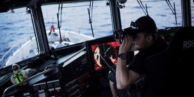 AT SEA - FEBRUARY 29: Norwegian Redningsselskapet rescue boat 'Peter Henry Von Koss' conducts a Frontex sea patrol on the northern shores of Lesbos island on February 29, 2016. Crew officer Andras Johansen (L) on the watch with binoculars for eventual refugee boats. Refugee boats would be monitored until they reach the Greek coast but no ID control is made at sea. Lesbos, the Greek vacation island in the Aegean Sea between Turkey and Greece, faces massive refugee flows from the Middle East countries. (Photo by Etienne De Malglaive/Getty Images)