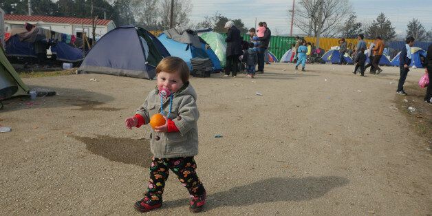 Idomeni, Greece - March 6, 2016: Refugee children are seen at the makeshift refugee camp in Idomeni, near the Greek-Macedonian border.