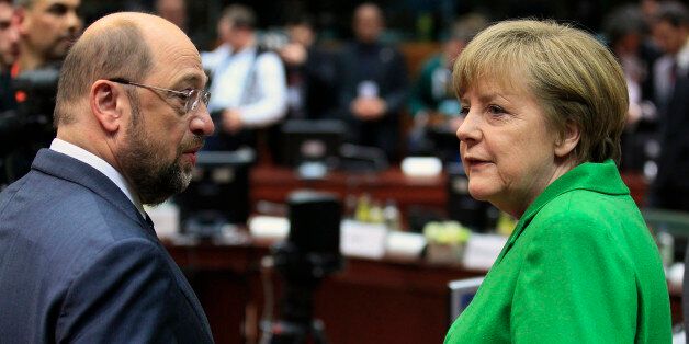 European Parliament President Martin Schulz (L) talks with Germany's Chancellor Angela Merkel at the start of European Union leaders summit in Brussels March 14, 2013. European leaders gathered in Brussels on Thursday with differences over austerity and how best to tackle the social costs of the debt crisis set to dominate their two-day summit. REUTERS/Yves Herman (BELGIUM - Tags: POLITICS BUSINESS EMPLOYMENT)